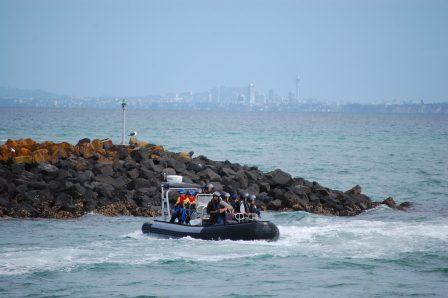 Jacob and Devon on a Navy Zodiac in Auckland Harbour